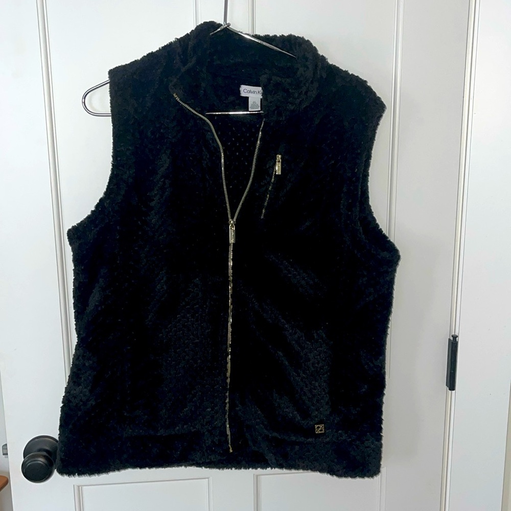 Black fur Calvin Klein vest with gold zippers and side pockets
